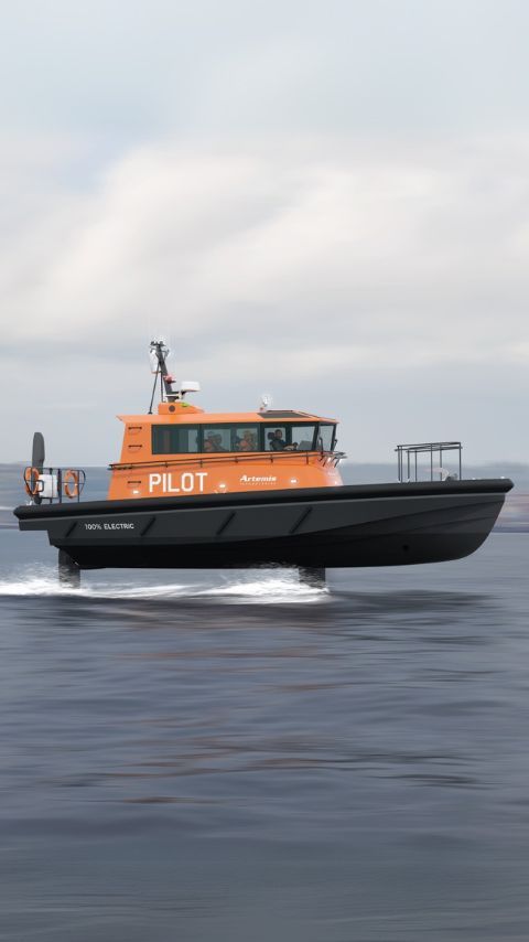 Foiling 100% electric pilot boat with Artemis Technologies and the word pilot on the side.