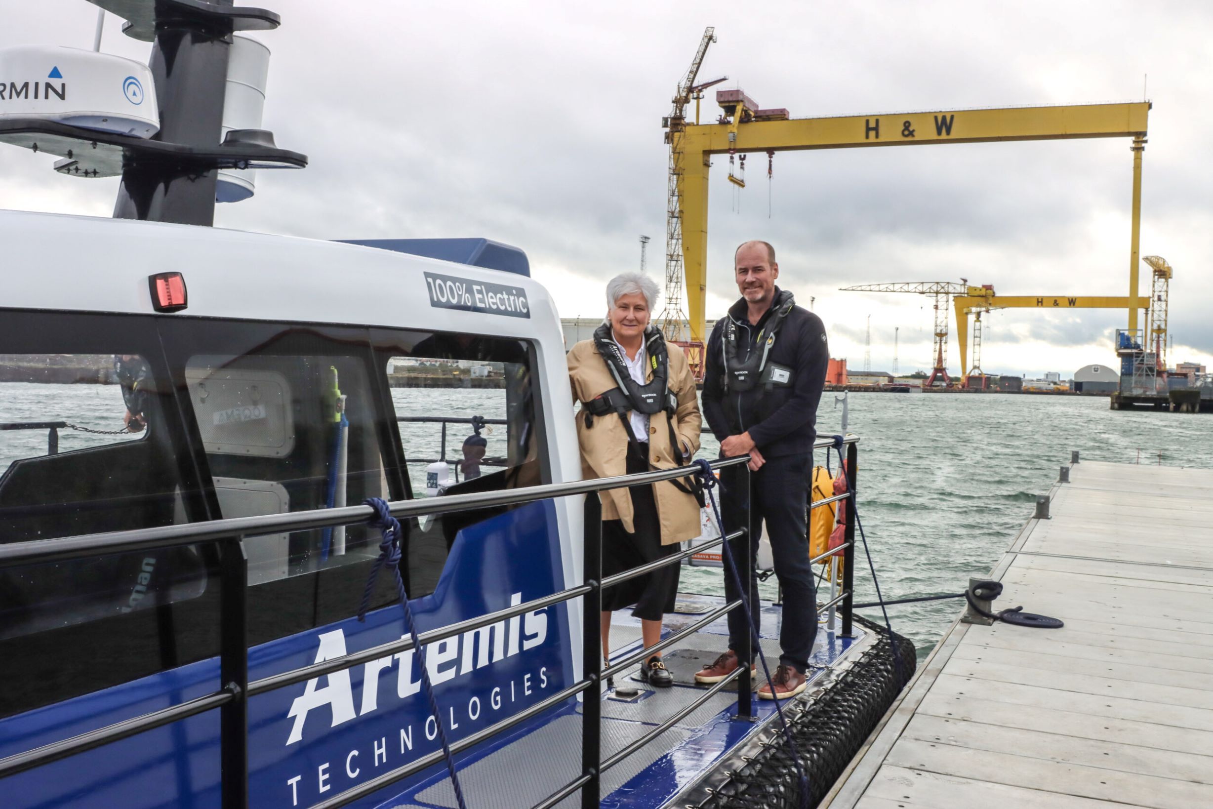 John Patterson standing with Baroness Goldie on deck of Pioneer