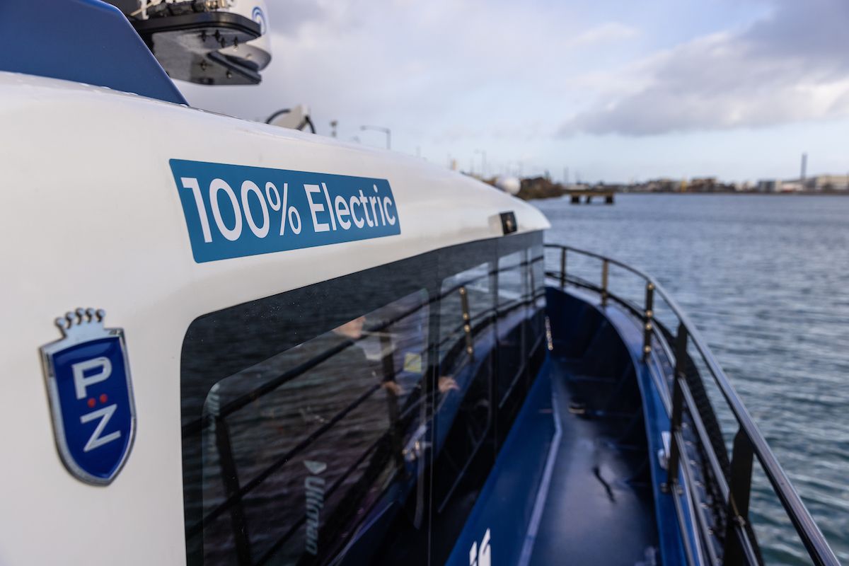 A close up of the Artemis EF-12 Workboat cabin and 100% electric wording