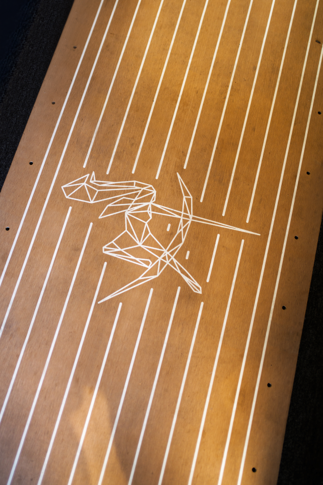 A white goddess design engraved on decking