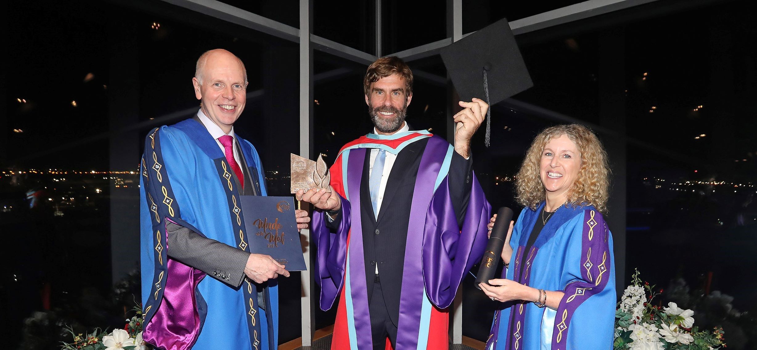 Iain Percy standing with two others from Belfast met