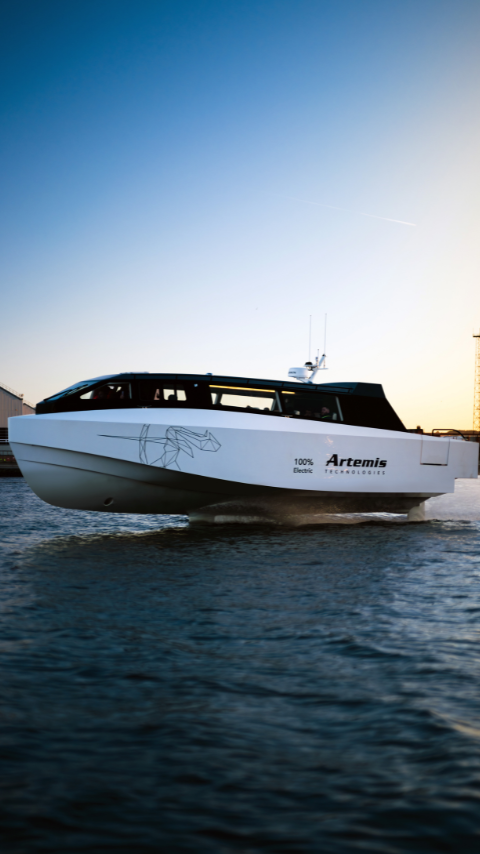 White hydrofoil boat at sunset