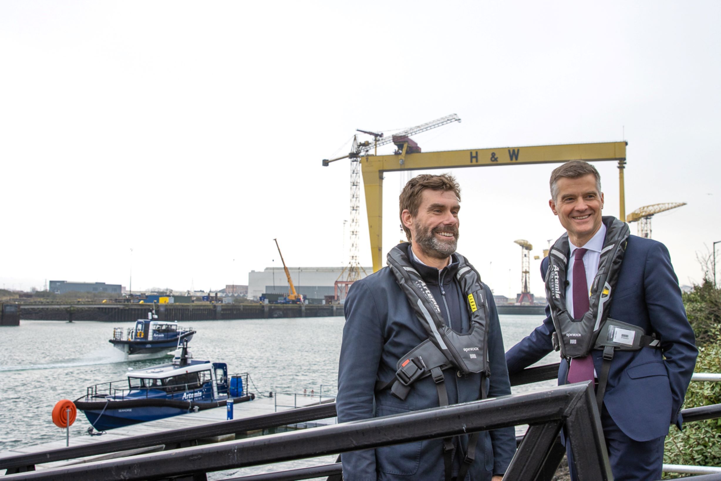 Iain Percy with one other standing on pontoon smiling