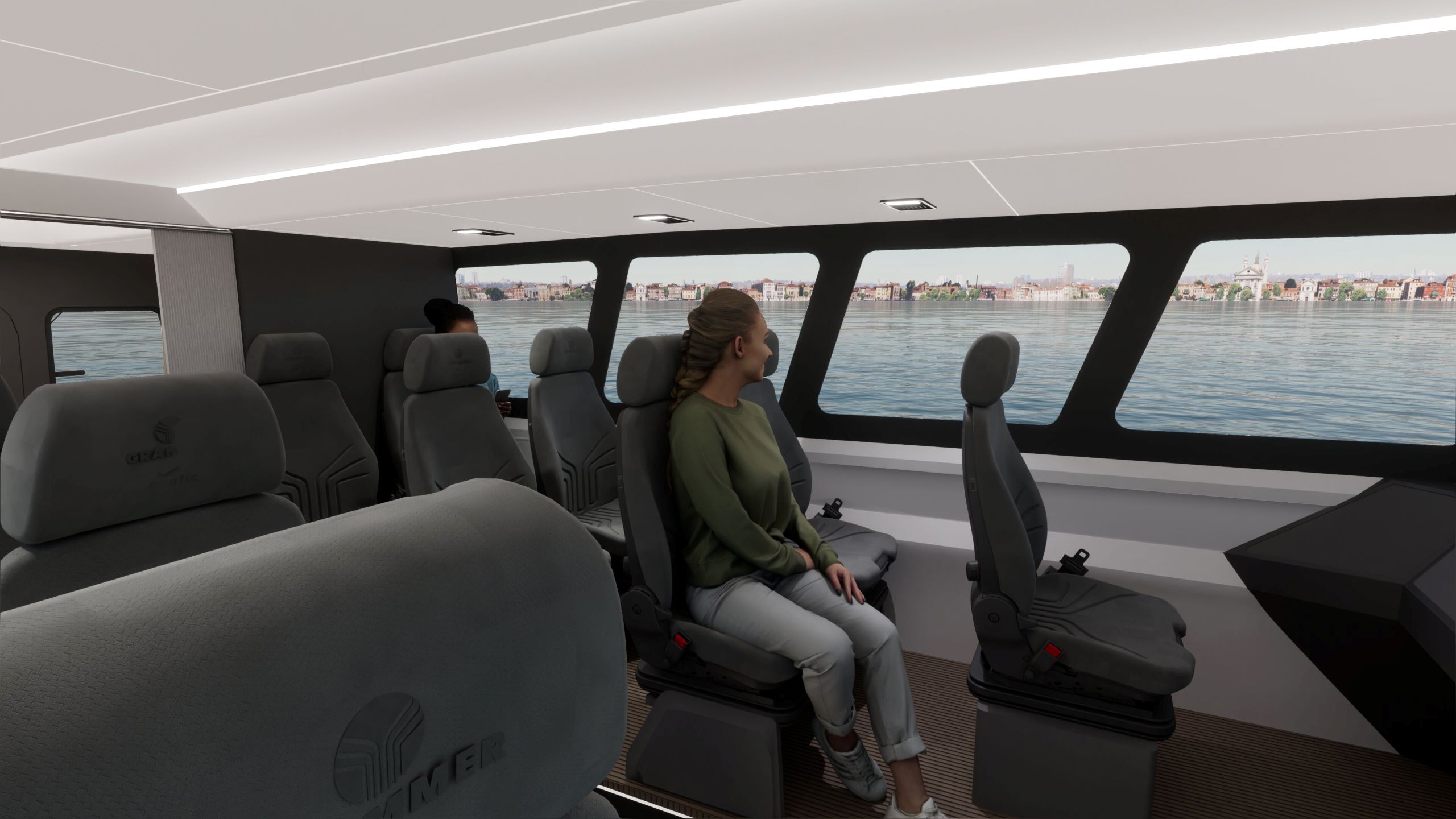 Artemis EF-12 Workboat XL boat interior with a lady sitting in a comfortable seat