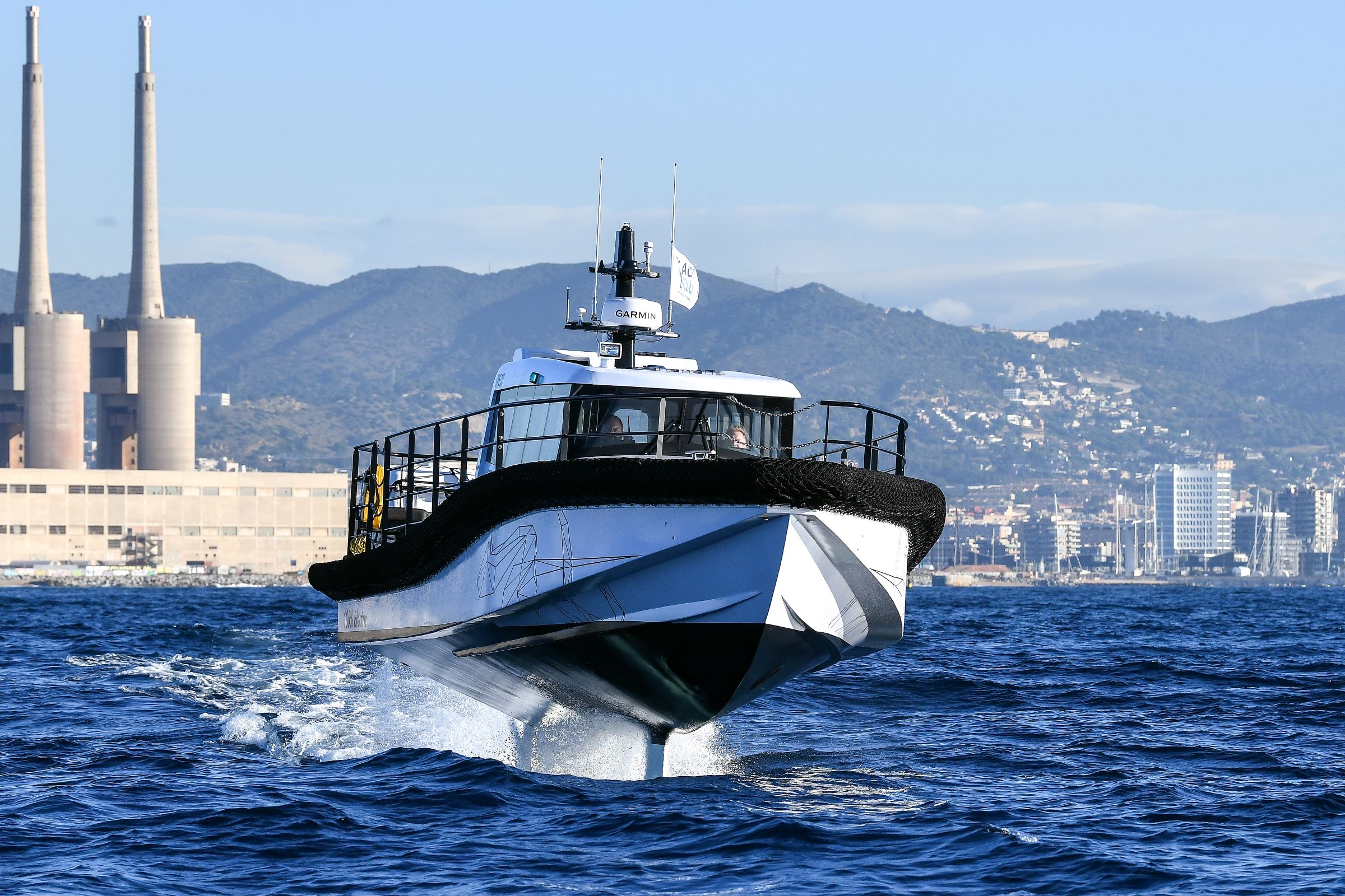 White Artemis EF-12 Workboat foiling in Barcelona