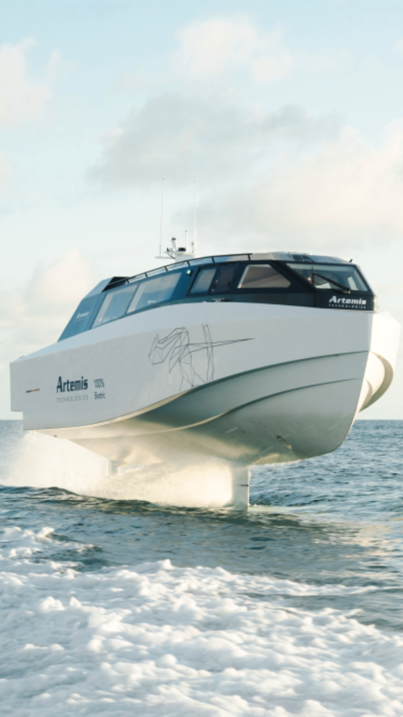 White boat hydrofoiling above water