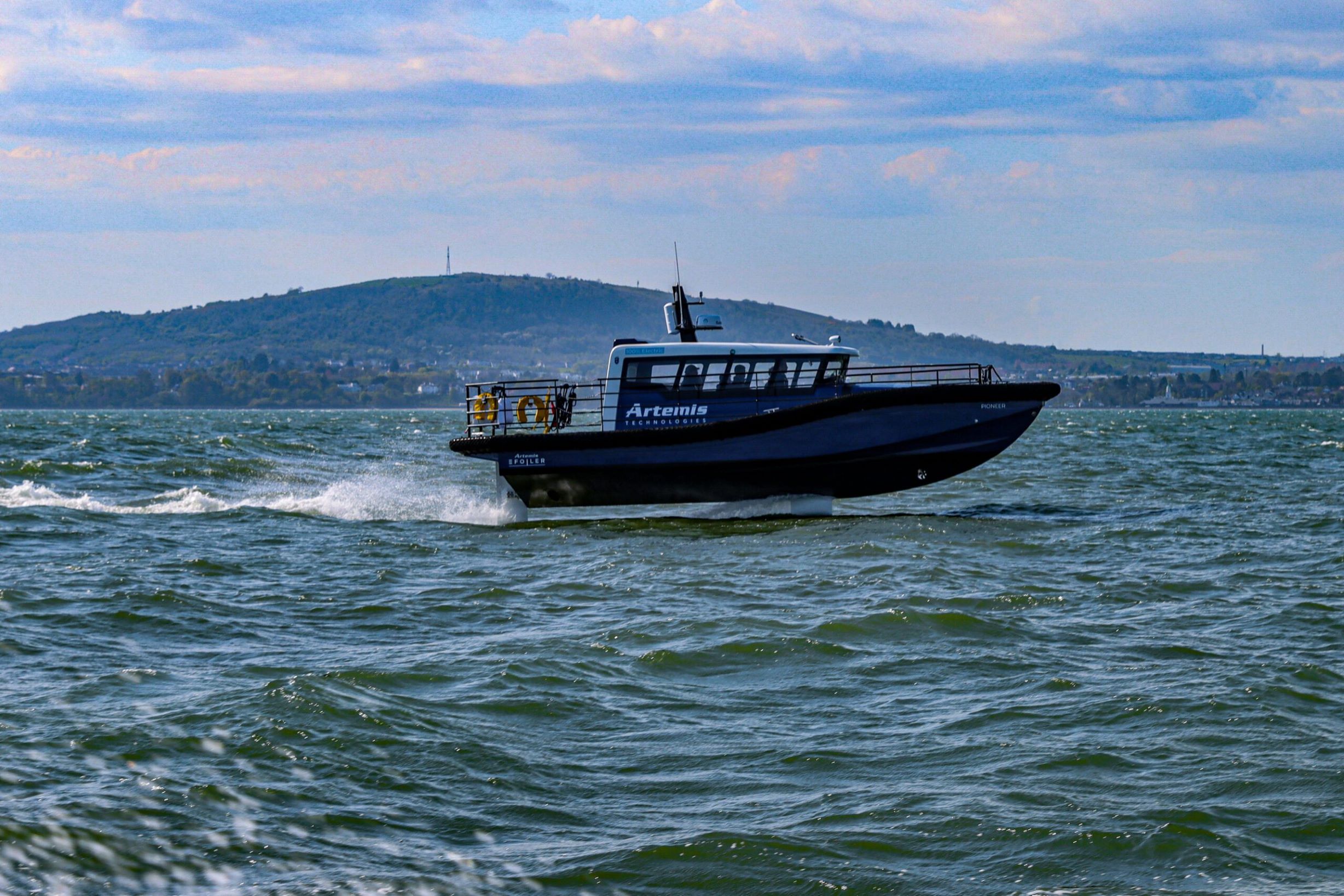 Artemis Technologies EF-12 Workboat foiling in rough sea