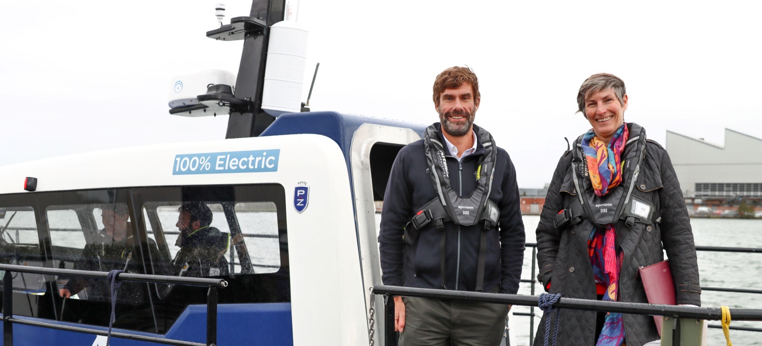 Iain Percy standing with one other on pioneer deck
