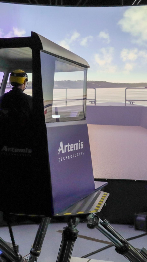 Image of Artemis Technologies Simulator in action with person in cabin operating