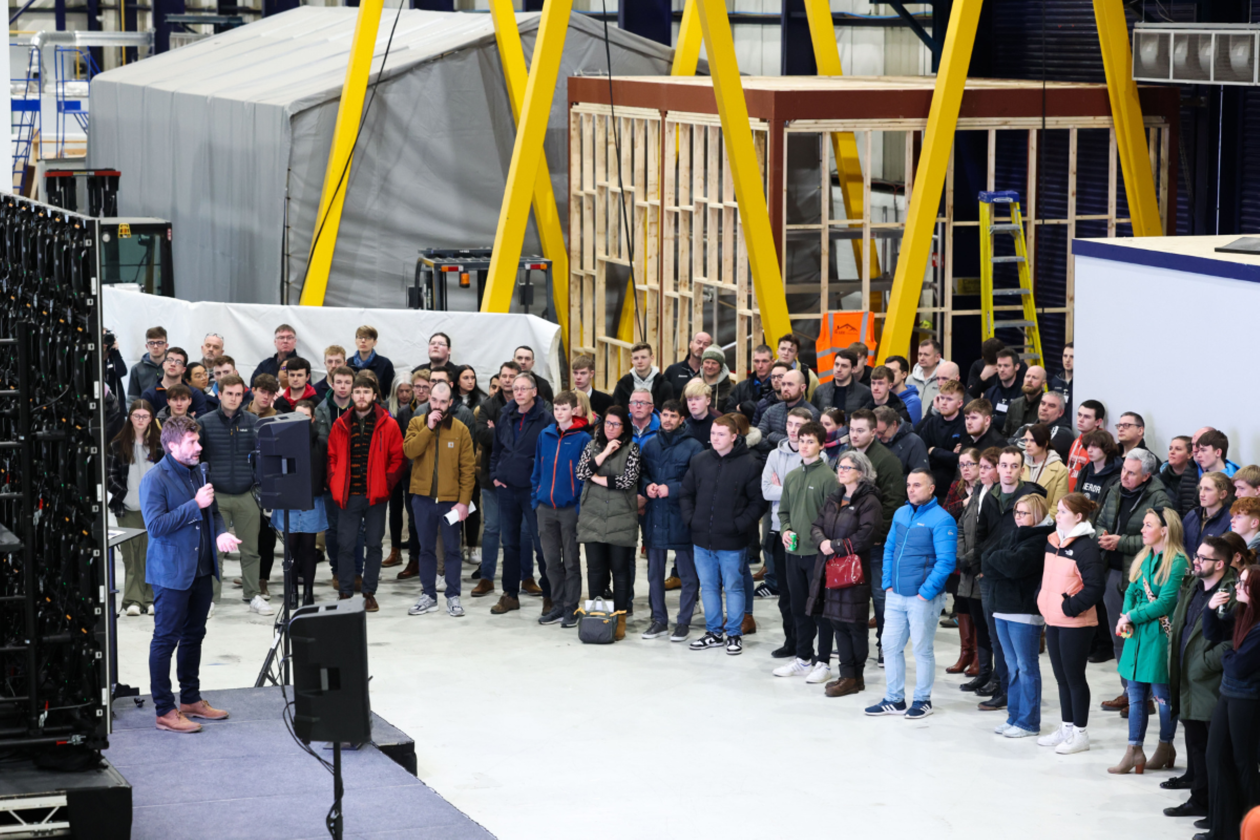 Iain Percy onstage addressing careers open evening audience