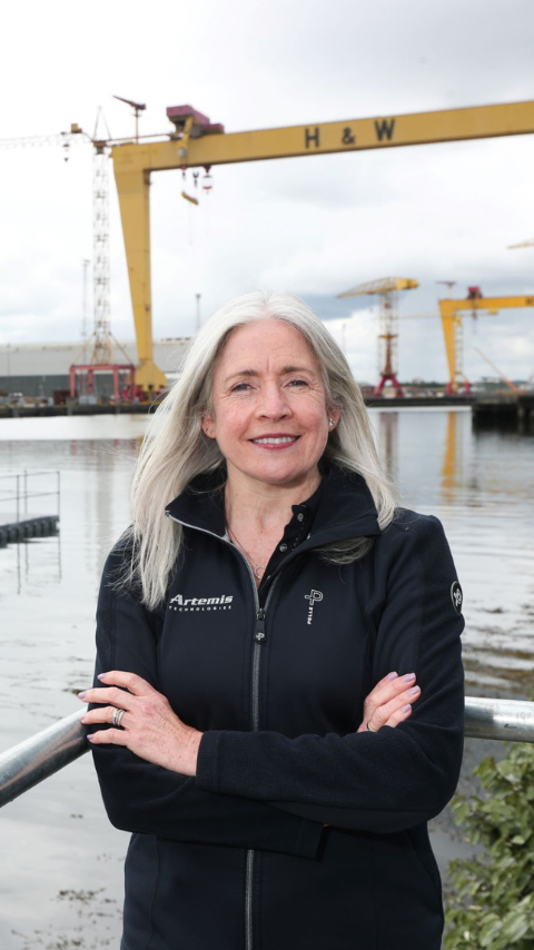 headshot of Katrina Thompson infront of pontoon and Harland and Wolf cranes