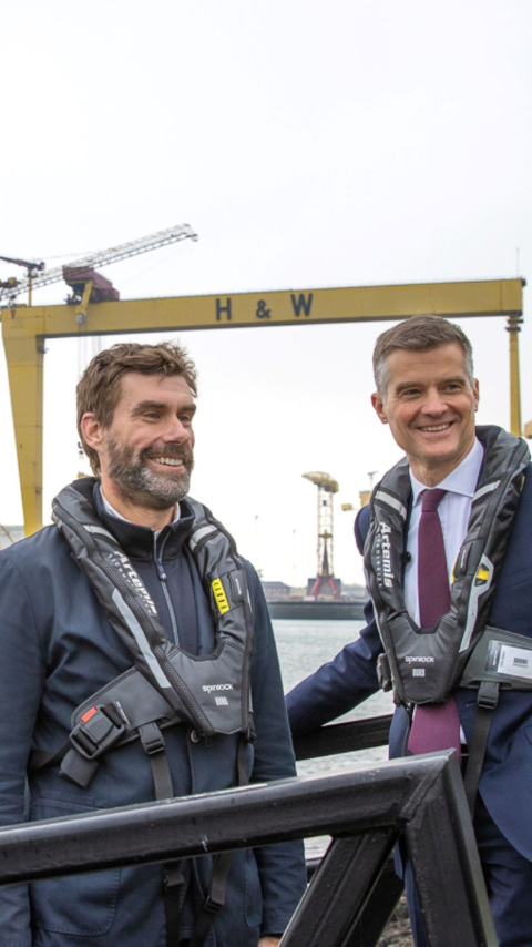 Iain Percy with one other standing on pontoon smiling