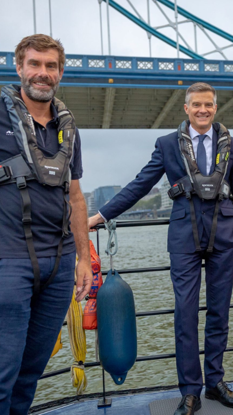 Iain Percy standing with two others on pioneer under London Bridge