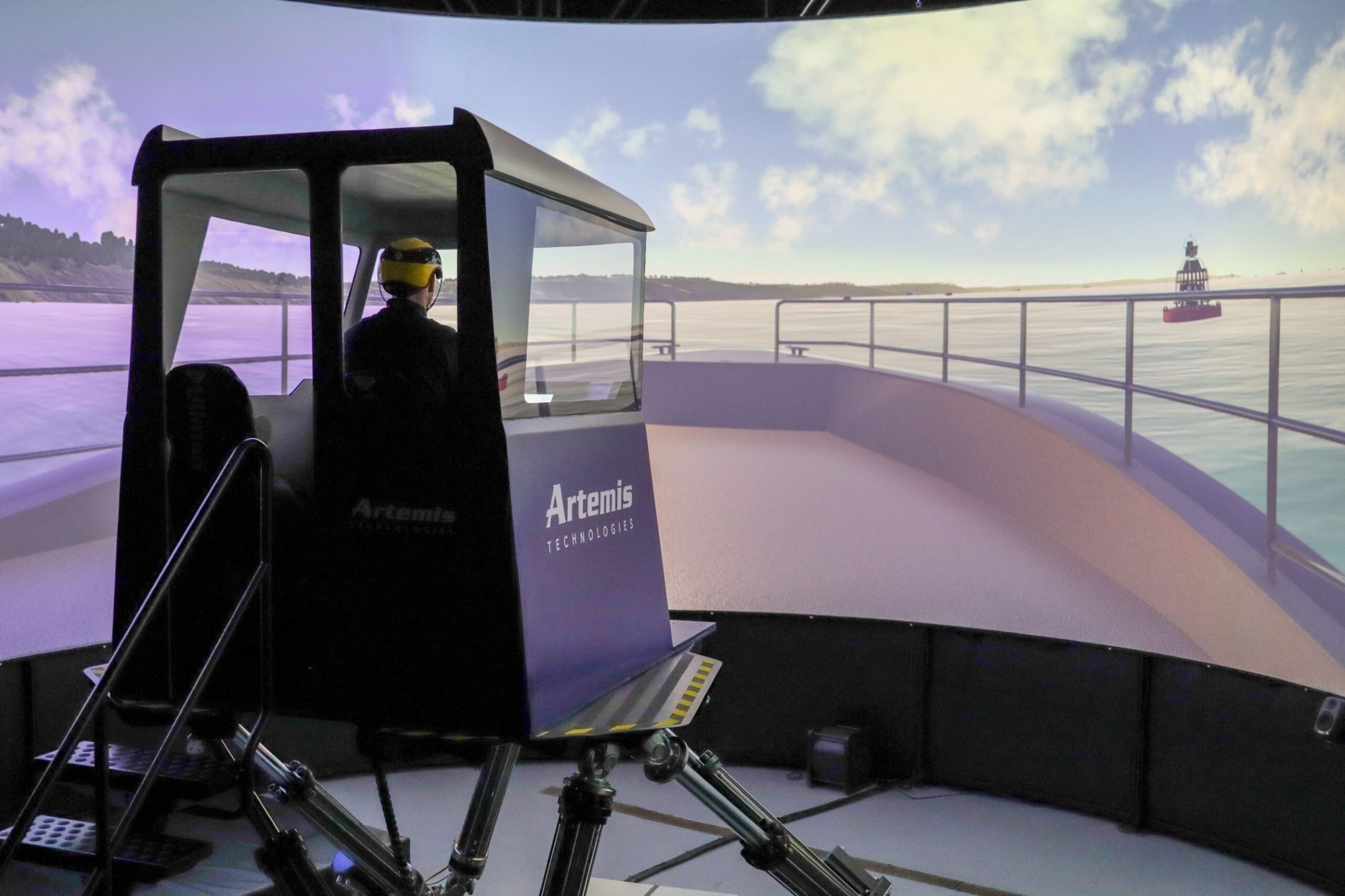 Image of Artemis Technologies Simulator in action with person in cabin operating