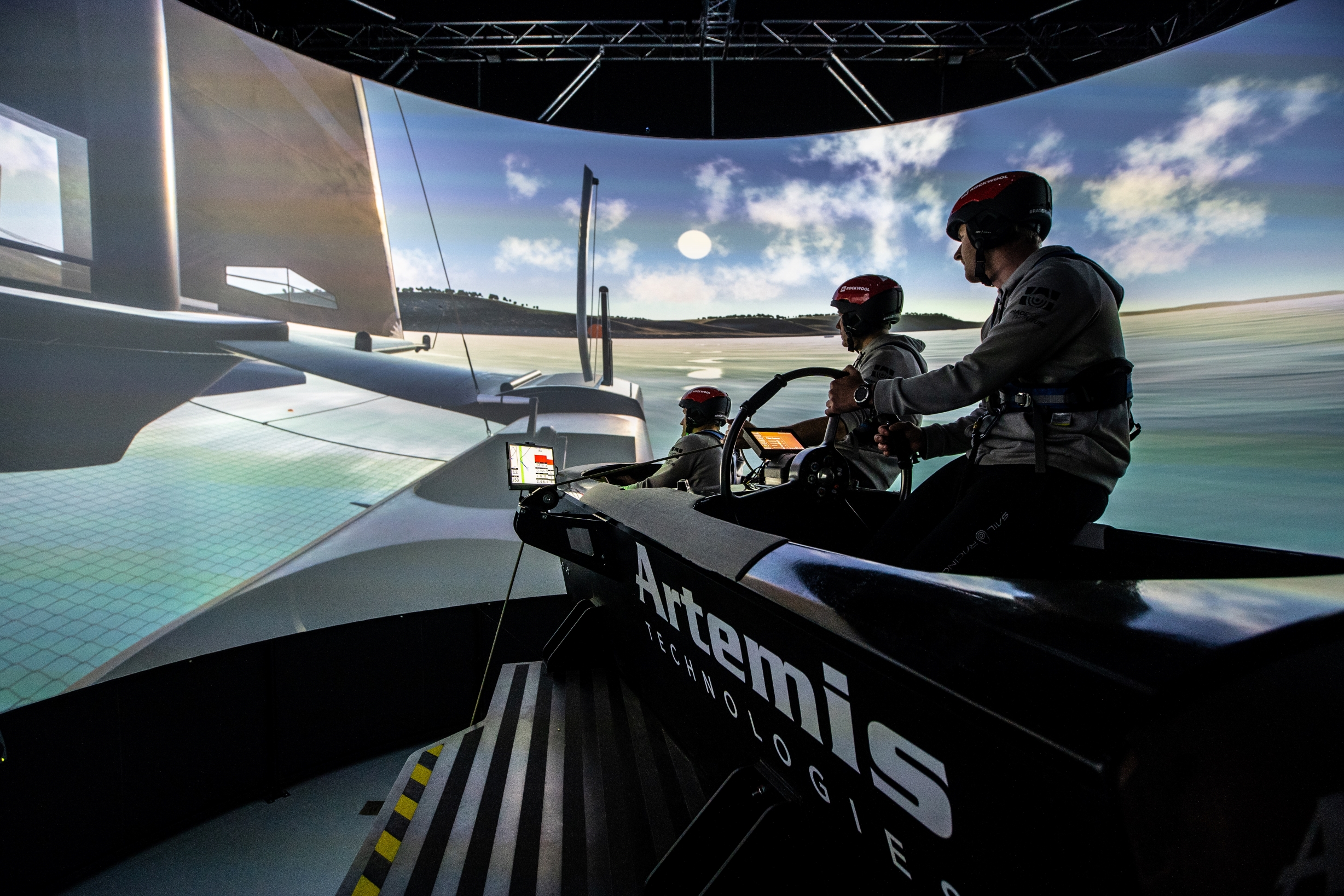 Three men from Denmark SailGP team in the F50 Simulator at Artemis Technologies