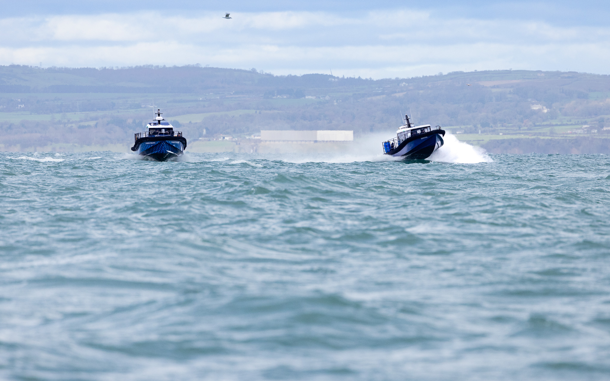 Two boats in parallel. One is foiling through the waves with stability and the other is a displacement vessel and is slamming through the waves