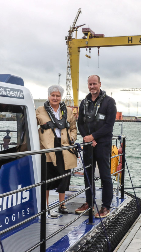 John Patterson standing with Baroness Goldie on deck of Pioneer