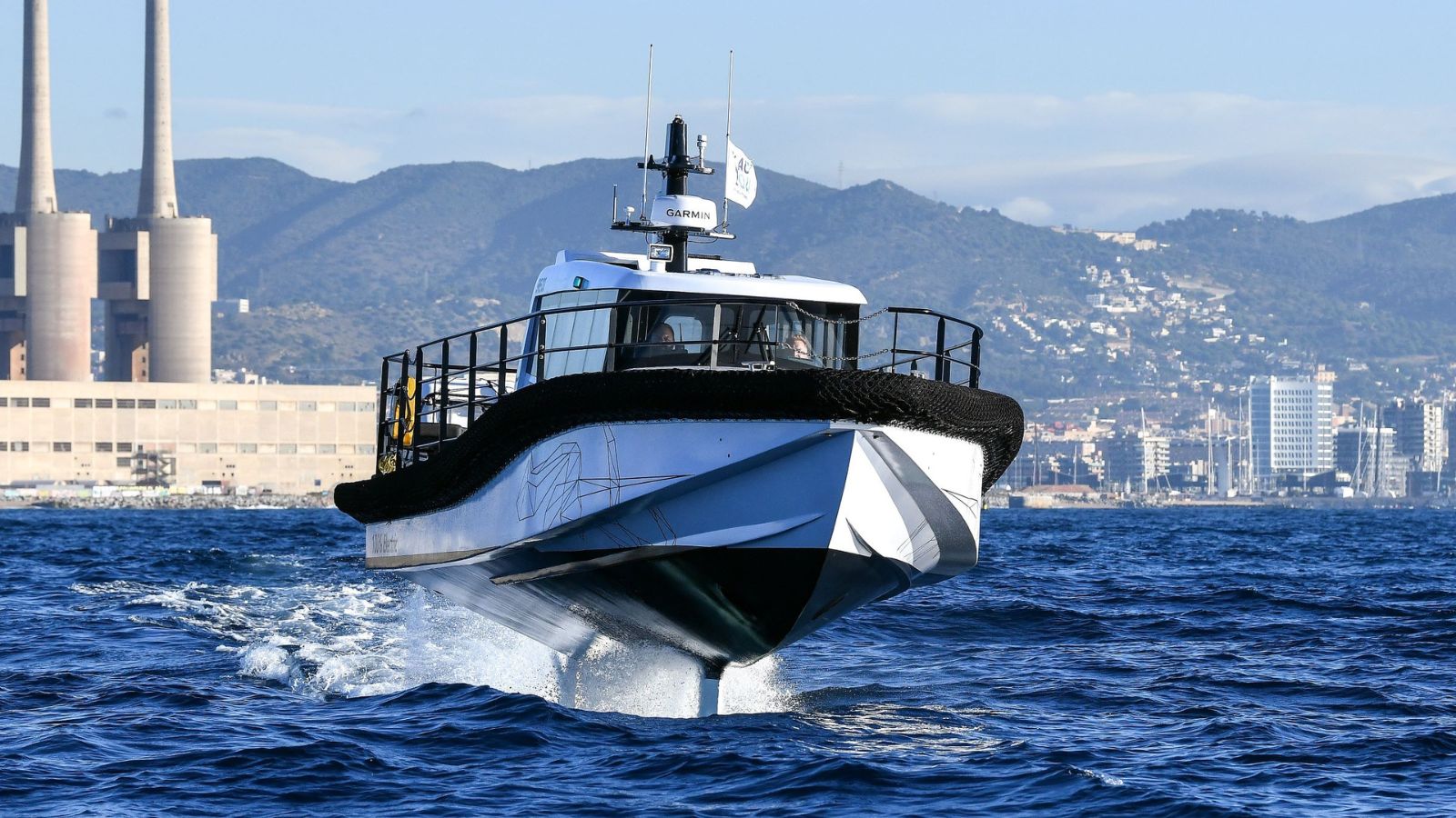 Artemis EF-12 Workboat in Barcelona with the port area in the background