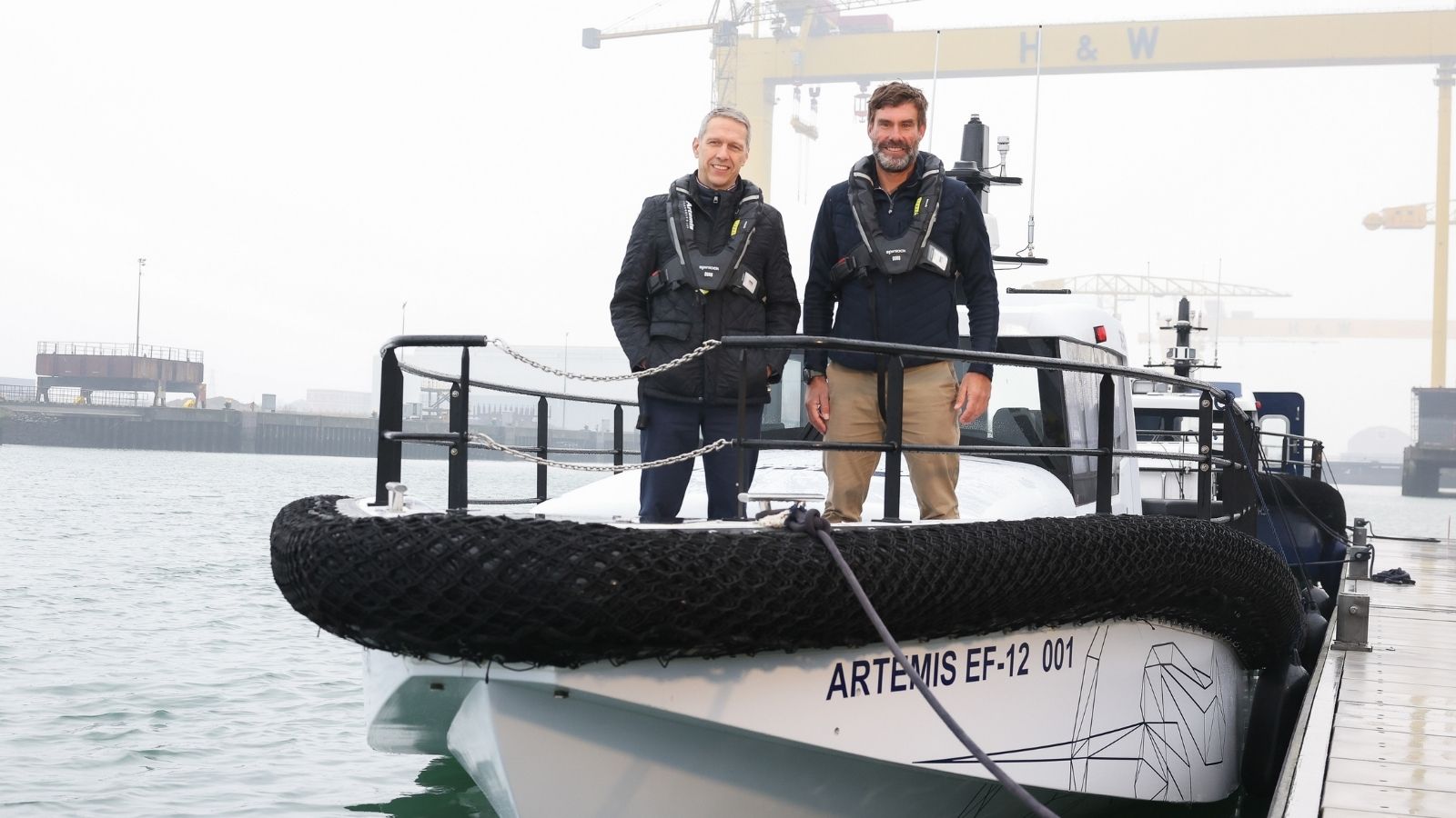 Matt Beeton, CEO of Port of Tyne and Dr Iain Percy, CEO Artemis Technologies on a white 100% electric Artemis EF-12 Workboat